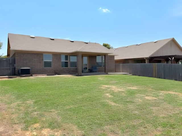 9525 SW 27th St, Oklahoma City, OK 73128 - rear view of property with central AC unit