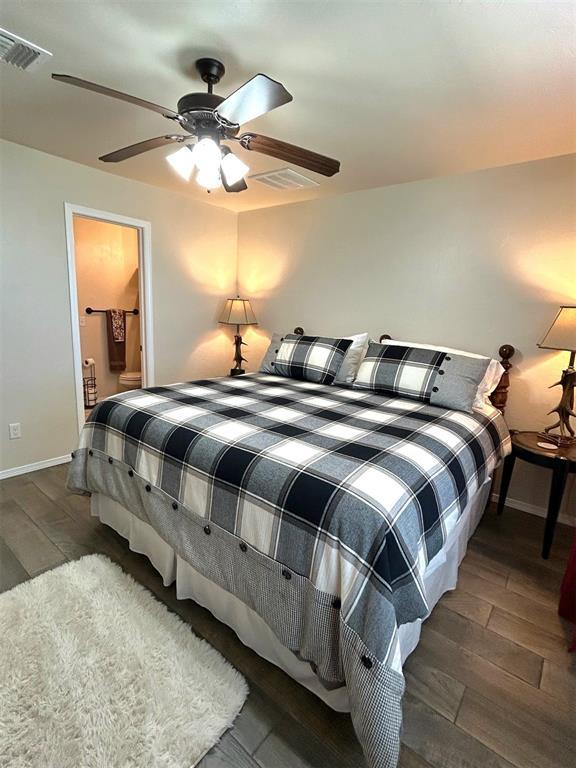9525 SW 27th St, Oklahoma City, OK 73128 - bedroom featuring wood finished floors, baseboards, and a ceiling fan