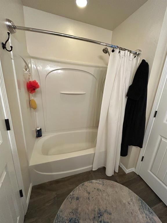 9525 SW 27th St, Oklahoma City, OK 73128 - bathroom with shower / bath combination with curtain and wood finished floors