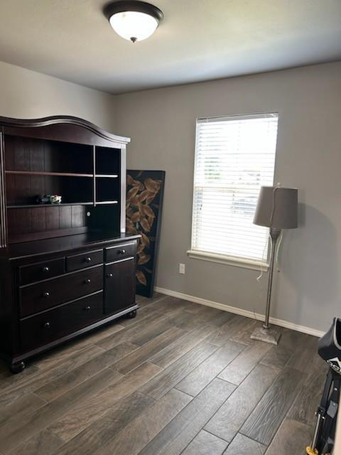 9525 SW 27th St, Oklahoma City, OK 73128 - bedroom featuring dark wood-type flooring and baseboards