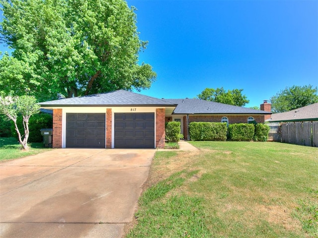817 E Hills Dr, Moore, OK 73160 - ranch-style home with an attached garage, driveway, and brick siding