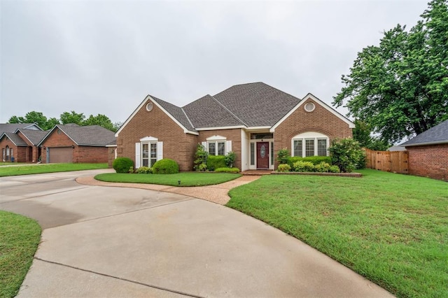 8 Brentwood Pl, Shawnee, OK 74804 - view of front of property with brick siding, roof with shingles, and driveway