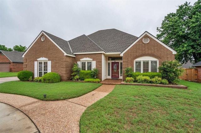 8 Brentwood Pl, Shawnee, OK 74804 - view of front of home with brick siding and roof with shingles