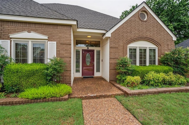 8 Brentwood Pl, Shawnee, OK 74804 - entrance to property with brick siding and roof with shingles