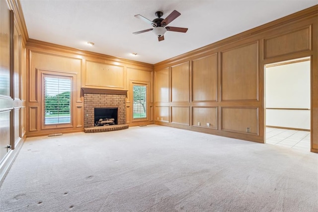 8 Brentwood Pl, Shawnee, OK 74804 - unfurnished living room with a decorative wall, ceiling fan, light colored carpet, and a fireplace