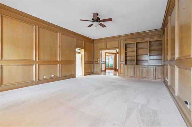8 Brentwood Pl, Shawnee, OK 74804 - empty room featuring a decorative wall, ceiling fan, light colored carpet, and ornamental molding