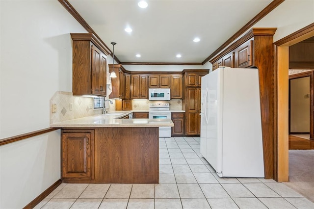 8 Brentwood Pl, Shawnee, OK 74804 - kitchen with white appliances, a sink, crown molding, light countertops, and a peninsula