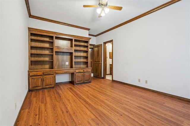 8 Brentwood Pl, Shawnee, OK 74804 - unfurnished office featuring ornamental molding, wood finished floors, a ceiling fan, built in desk, and baseboards
