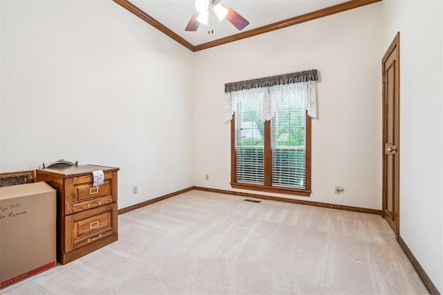 8 Brentwood Pl, Shawnee, OK 74804 - spare room featuring ceiling fan, light colored carpet, crown molding, baseboards, and lofted ceiling