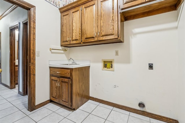 8 Brentwood Pl, Shawnee, OK 74804 - laundry room featuring hookup for an electric dryer, washer hookup, cabinet space, light tile patterned floors, and baseboards