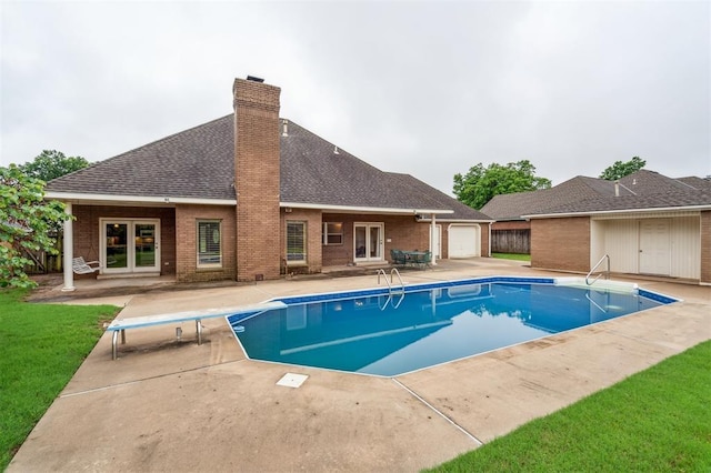 8 Brentwood Pl, Shawnee, OK 74804 - view of pool with french doors, a diving board, a patio, and a yard