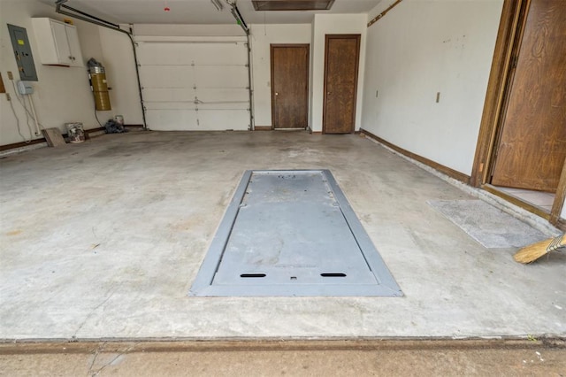 8 Brentwood Pl, Shawnee, OK 74804 - garage featuring electric panel and a central vacuum unit