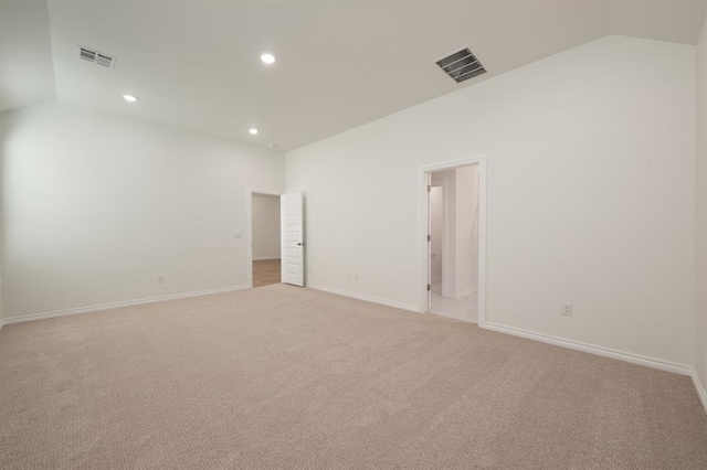 2836 NW 28th St, Yukon, OK 73099 - spare room with lofted ceiling, light colored carpet, recessed lighting, and baseboards