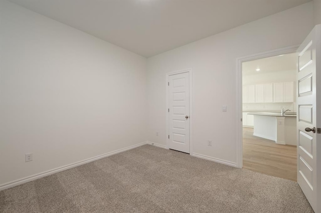 2836 NW 28th St, Yukon, OK 73099 - unfurnished bedroom featuring light colored carpet and baseboards