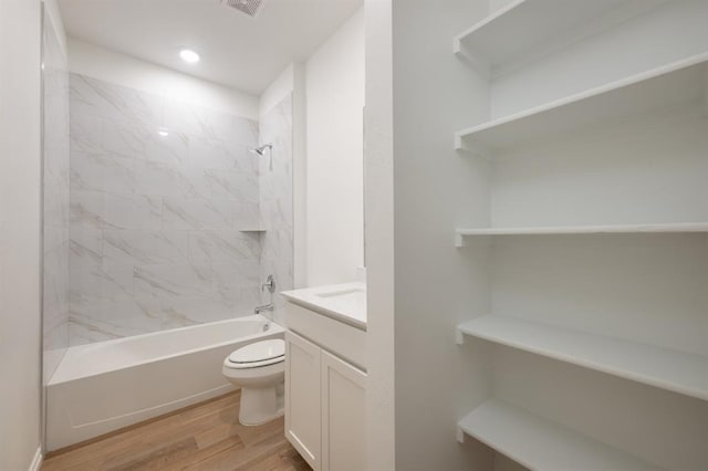 2836 NW 28th St, Yukon, OK 73099 - full bath with wood finished floors, toilet, vanity,  shower combination, and recessed lighting