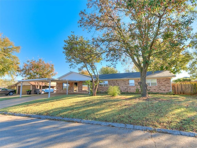 1202 N 8th Ave, Purcell, OK 73080 - single story home with a carport and brick siding