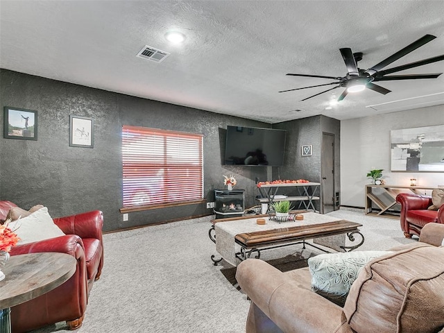 1202 N 8th Ave, Purcell, OK 73080 - carpeted living room featuring a ceiling fan, a textured ceiling, baseboards, a textured wall, and recessed lighting