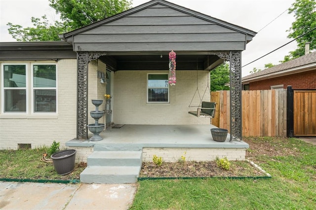 4301 NW 18th St, Oklahoma City, OK 73107 - view of front facade with brick siding and a porch