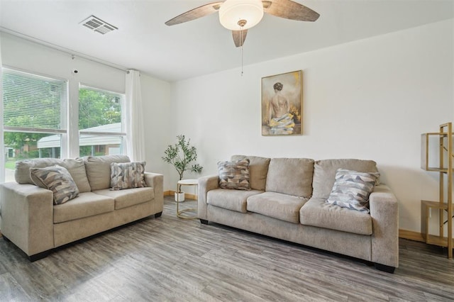4301 NW 18th St, Oklahoma City, OK 73107 - living area featuring wood finished floors, a ceiling fan, and baseboards