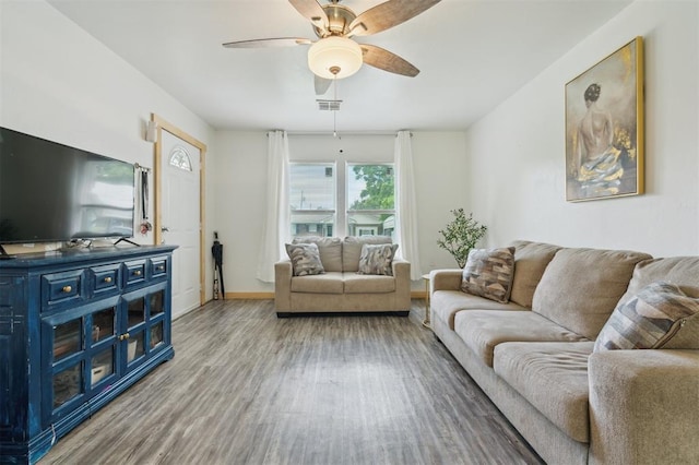 4301 NW 18th St, Oklahoma City, OK 73107 - living area featuring wood finished floors, ceiling fan, and baseboards