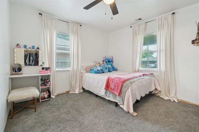 4301 NW 18th St, Oklahoma City, OK 73107 - bedroom featuring multiple windows, carpet, ceiling fan, and baseboards