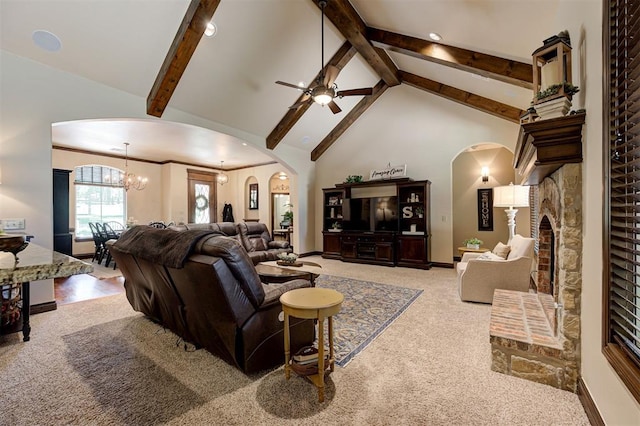 2139 Rivanna Way, Edmond, OK 73034 - living room featuring arched walkways, carpet floors, a ceiling fan, beamed ceiling, and high vaulted ceiling