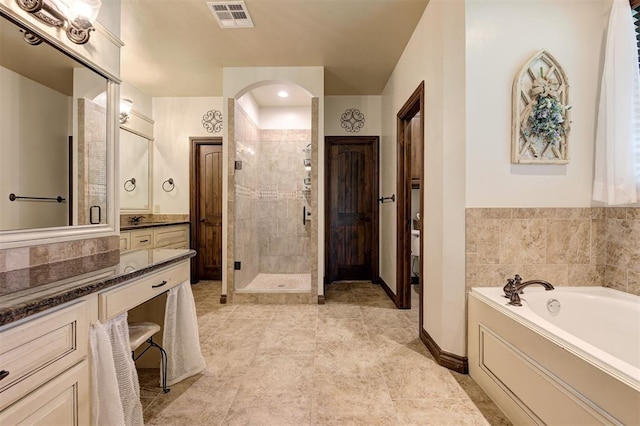 2139 Rivanna Way, Edmond, OK 73034 - full bathroom with vanity, a shower stall, and a garden tub