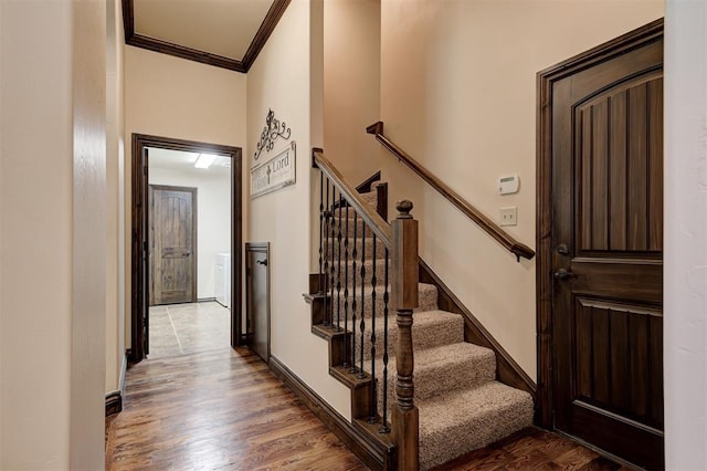 2139 Rivanna Way, Edmond, OK 73034 - entryway featuring crown molding, wood finished floors, and stairway