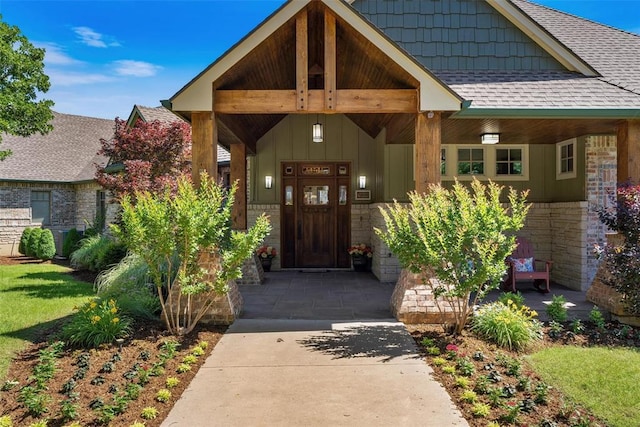 1516 Brook Bank Dr, Jones, OK 73049 - view of exterior entry featuring roof with shingles, a porch, board and batten siding, and stone siding