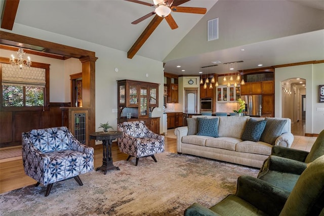 1516 Brook Bank Dr, Jones, OK 73049 - living area with a chandelier, ceiling fan, high vaulted ceiling, arched walkways, and light wood-type flooring
