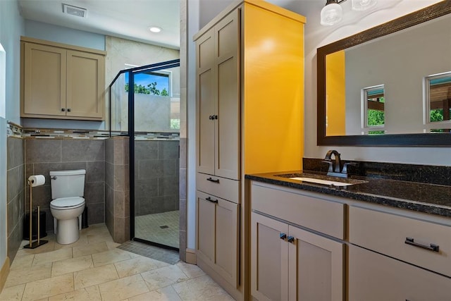 1516 Brook Bank Dr, Jones, OK 73049 - full bath with vanity, a stall shower, toilet, tile walls, and recessed lighting