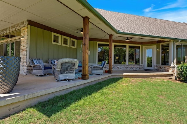 1516 Brook Bank Dr, Jones, OK 73049 - back of property with ceiling fan, a yard, a shingled roof, and board and batten siding