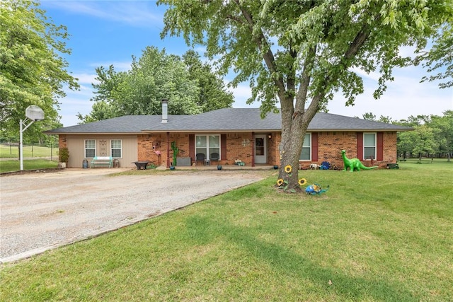 2336 County Road 1222, Blanchard, OK 73010 - ranch-style house featuring driveway, a front yard, and brick siding