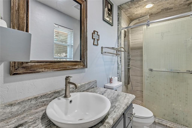 2336 County Road 1222, Blanchard, OK 73010 - full bathroom featuring toilet, a stall shower, and vanity