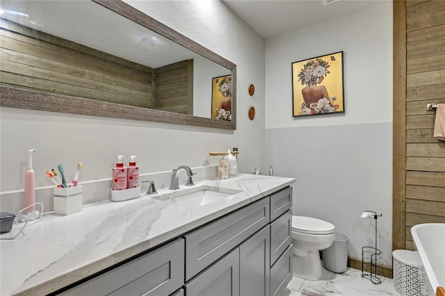 2336 County Road 1222, Blanchard, OK 73010 - bathroom featuring vanity, marble finish flooring, a freestanding tub, and toilet