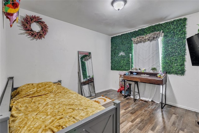 2336 County Road 1222, Blanchard, OK 73010 - bedroom with wood finished floors and baseboards