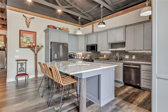 2336 County Road 1222, Blanchard, OK 73010 - kitchen featuring appliances with stainless steel finishes, gray cabinetry, and backsplash