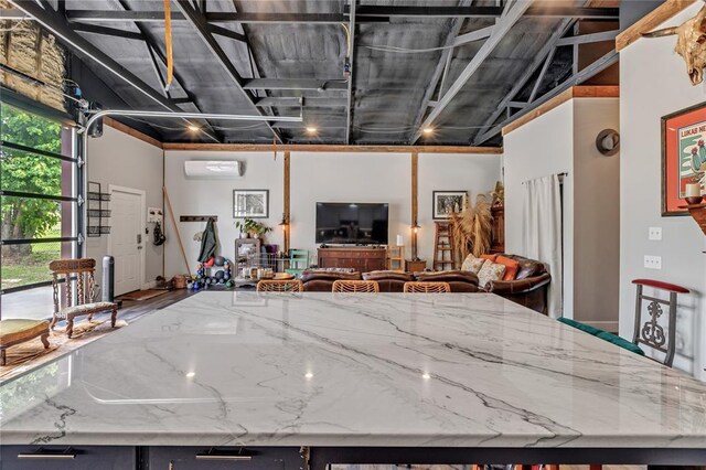 2336 County Road 1222, Blanchard, OK 73010 - kitchen with open floor plan, light stone countertops, and a kitchen island
