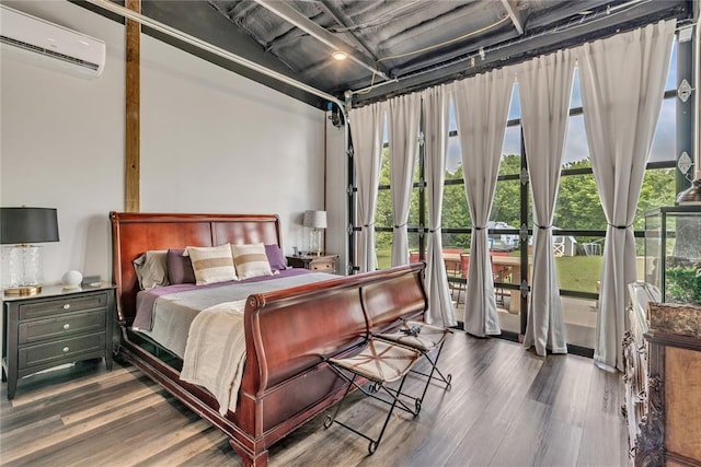 2336 County Road 1222, Blanchard, OK 73010 - bedroom featuring a wall mounted air conditioner and wood finished floors