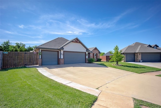 1225 N Nature Way, Mustang, OK 73064 - view of front of house featuring brick siding, a garage, and concrete driveway