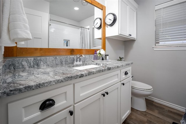 1225 N Nature Way, Mustang, OK 73064 - full bathroom featuring vanity, toilet, wood finished floors, baseboards, and a shower with curtain