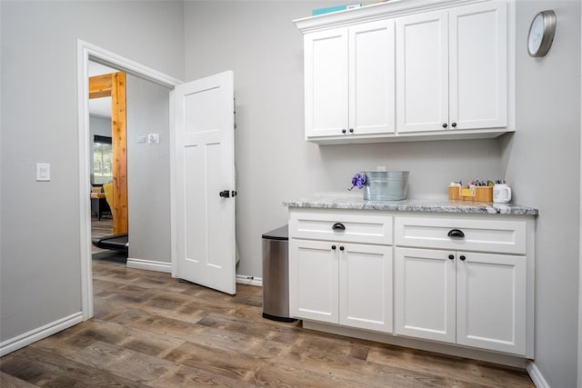 1225 N Nature Way, Mustang, OK 73064 - laundry area with dark wood finished floors and baseboards