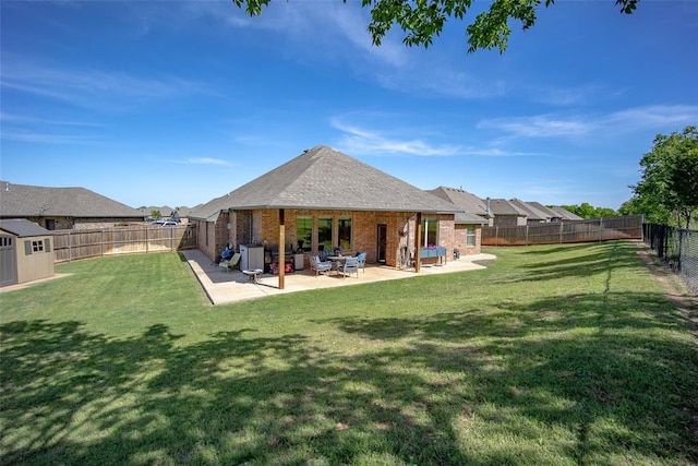 1225 N Nature Way, Mustang, OK 73064 - back of property featuring brick siding and a patio