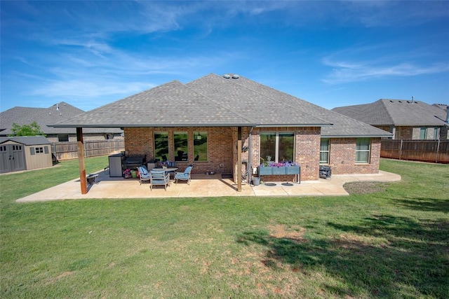 1225 N Nature Way, Mustang, OK 73064 - back of property featuring brick siding, a patio area, and roof with shingles
