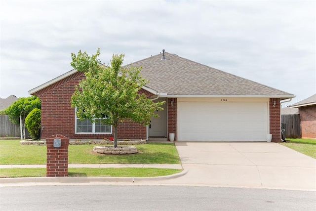 2304 NW 196th Ter, Edmond, OK 73012 - view of front of home featuring an attached garage, concrete driveway, brick siding, a front lawn, and a shingled roof