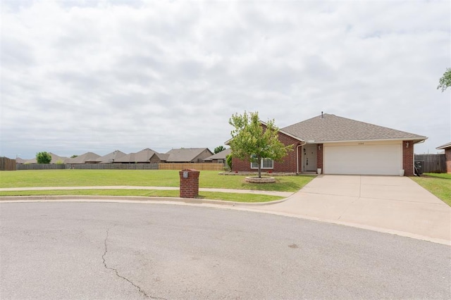 2304 NW 196th Ter, Edmond, OK 73012 - view of front facade featuring concrete driveway, an attached garage, and brick siding