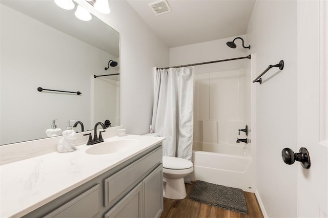 2304 NW 196th Ter, Edmond, OK 73012 - bathroom featuring vanity, wood finished floors, toilet, and shower / tub combo with curtain