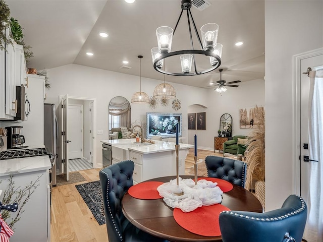 13325 SW 5th St, Yukon, OK 73099 - dining area with a ceiling fan, a chandelier, light wood-style flooring, recessed lighting, and lofted ceiling