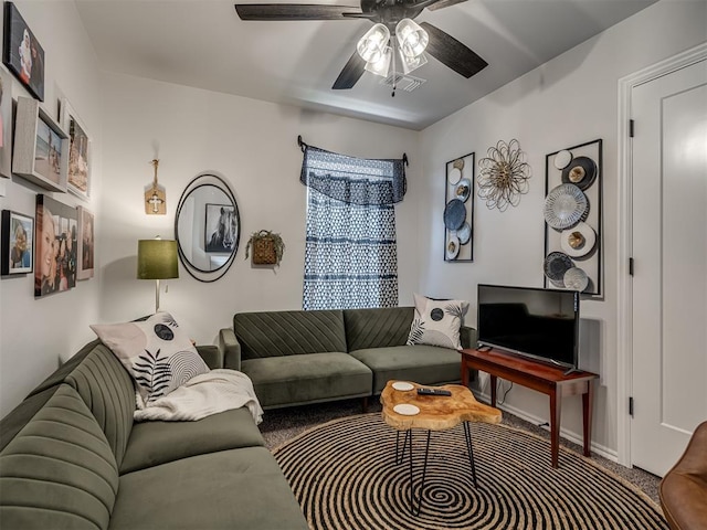 13325 SW 5th St, Yukon, OK 73099 - living room featuring ceiling fan, carpet, and baseboards