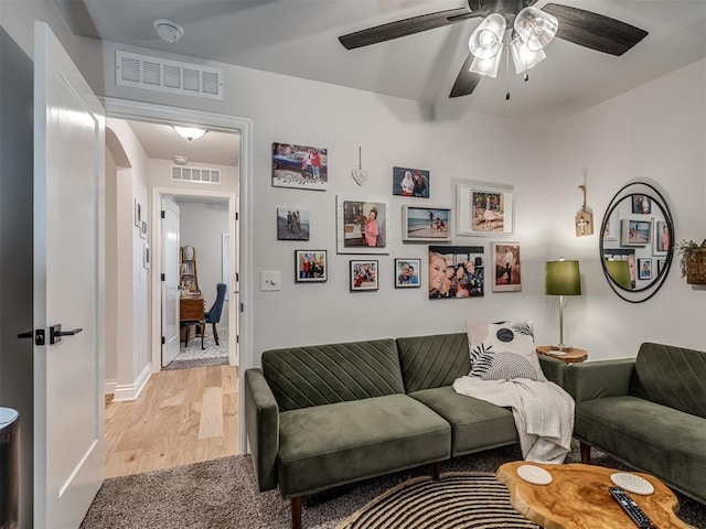 13325 SW 5th St, Yukon, OK 73099 - living area with a ceiling fan, light wood finished floors, and baseboards